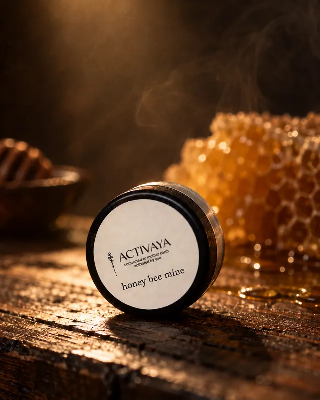 Honey Bee Mine lip balm tin beside honeycomb